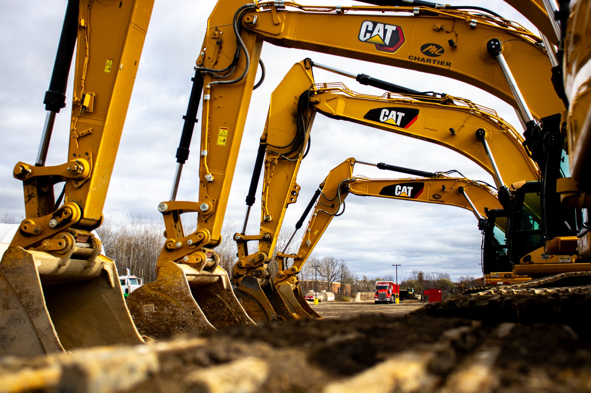 5 Excavators Lined Up Close Track 2 11.2023